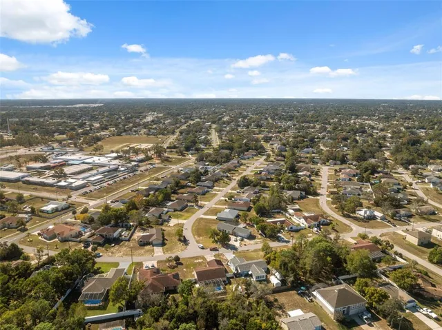 an aerial view of residential building and green space