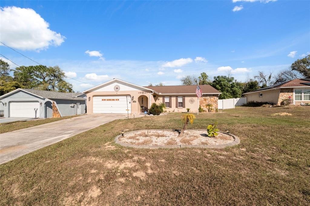 12265 Shafton Road Spring Hill, FL 34608 - Photo 42 of 51 a front view of a house with a yard