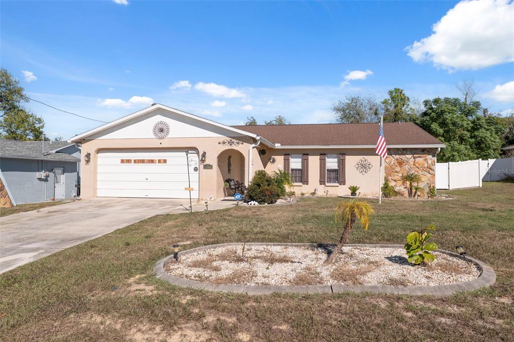 12265 Shafton Road Spring Hill, FL 34608 - Photo 43 of 51 a front view of a house with a yard