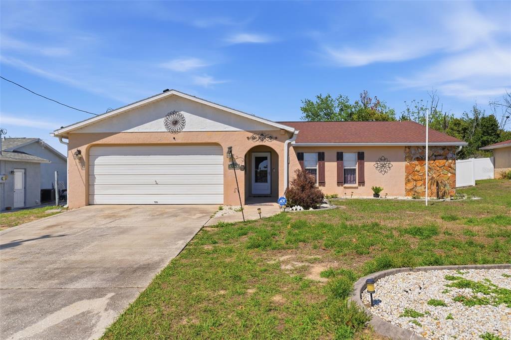 12265 Shafton Road Spring Hill, FL 34608 - Photo 46 of 58 a front view of a house with a yard