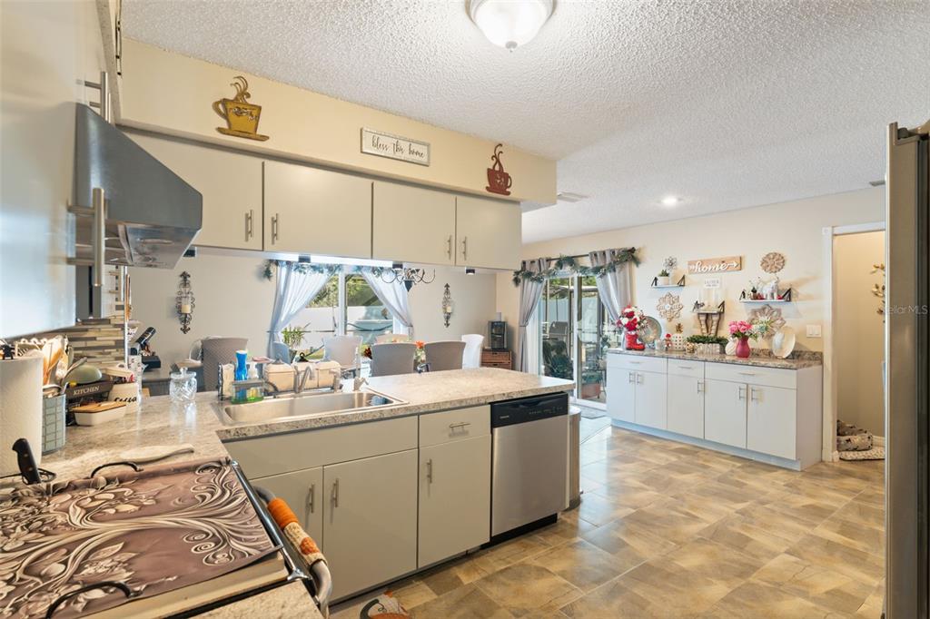 12265 Shafton Road Spring Hill, FL 34608 - Photo 47 of 51 a room with lot of white furniture and window