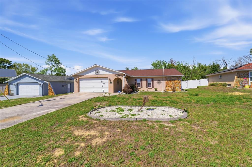12265 Shafton Road Spring Hill, FL 34608 - Photo 47 of 58 a front view of a house with a yard