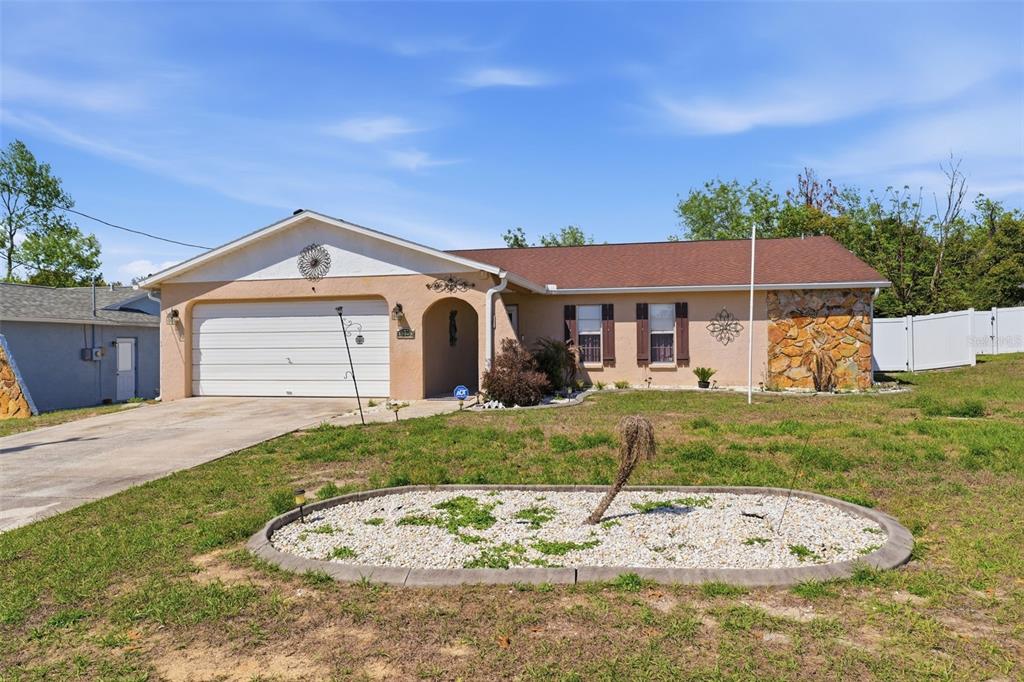 12265 Shafton Road Spring Hill, FL 34608 - Photo 49 of 58 a front view of a house with a yard