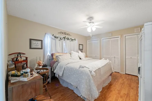 a bedroom with furniture and a window
