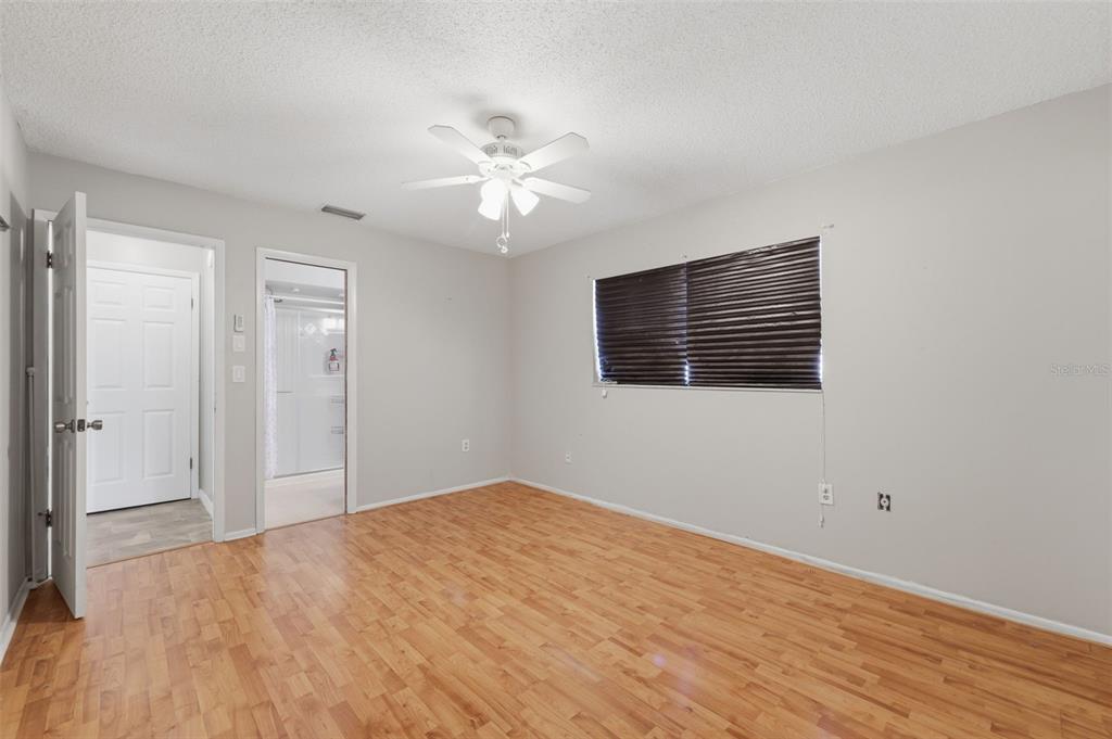 12265 Shafton Road Spring Hill, FL 34608 - Photo 56 of 58 a view of empty room with wooden floor