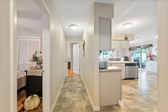 a kitchen with a sink cabinets and appliances