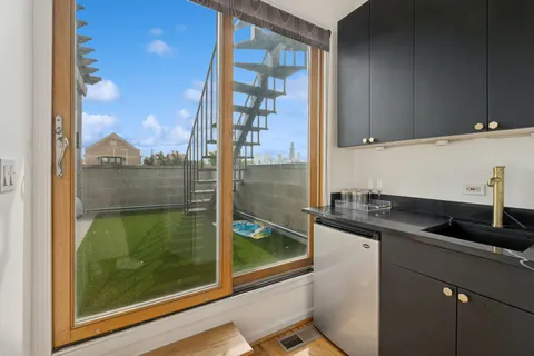 a kitchen with granite countertop a sink and a window