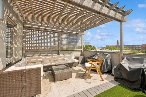 a view of a chairs and table in the terrace