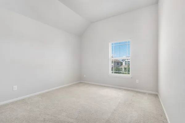 a bathroom with a sink a toilet and a large mirror