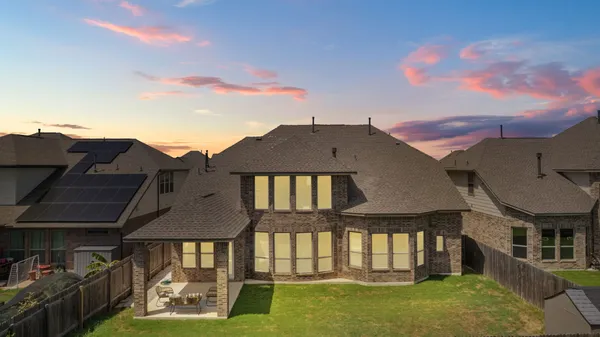 an aerial view of a house with outdoor space
