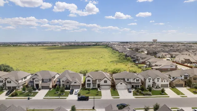 an aerial view of a house with a ocean view
