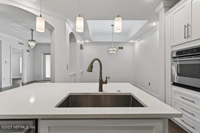 a view of a room with wooden floor and window