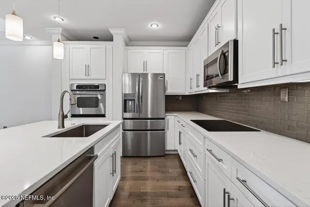 a spacious bedroom with a bed and a large window