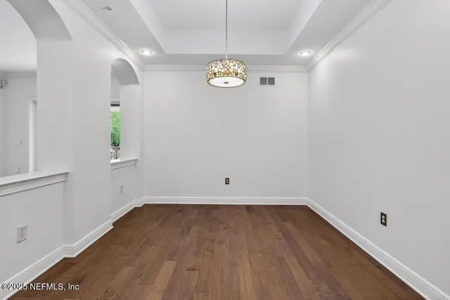 a spacious bathroom with a double vanity sink a large mirror and a shower
