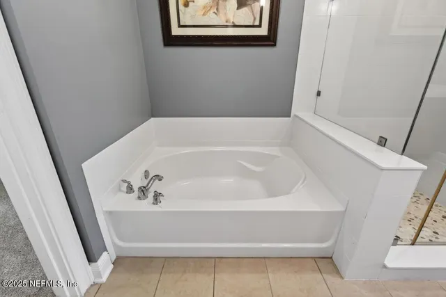 a bathroom with a granite countertop sink a toilet and bathtub