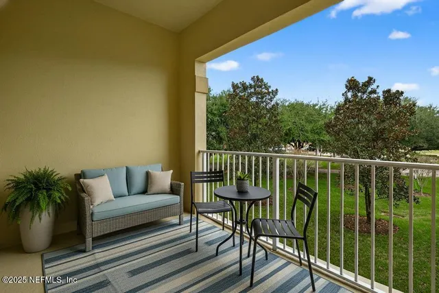 a view of a hallway with wooden floor and a window