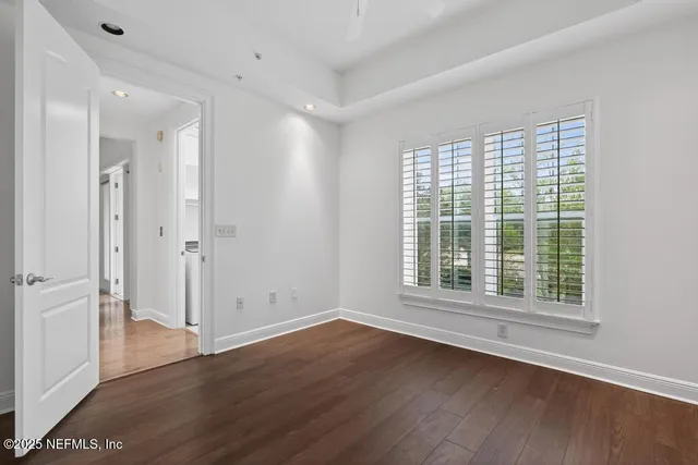 a living room with furniture a table and a chandelier