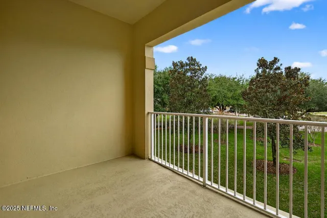 a view of a park with large trees