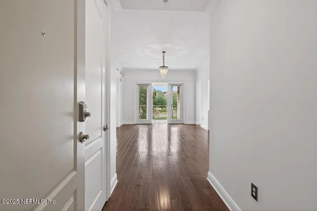 a view of kitchen with stainless steel appliances refrigerator oven and cabinets