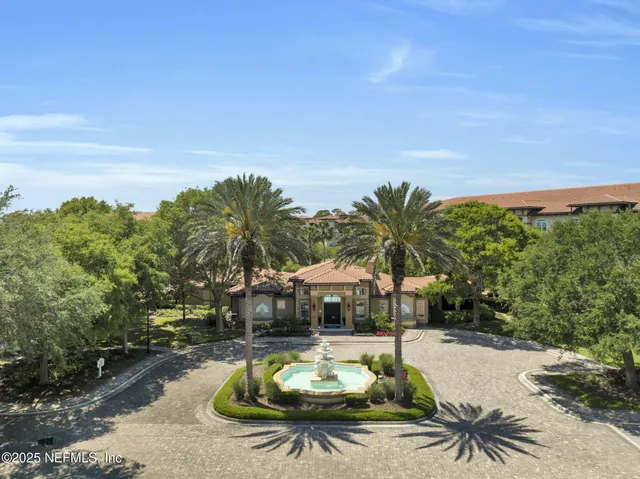 a view of street with palm trees