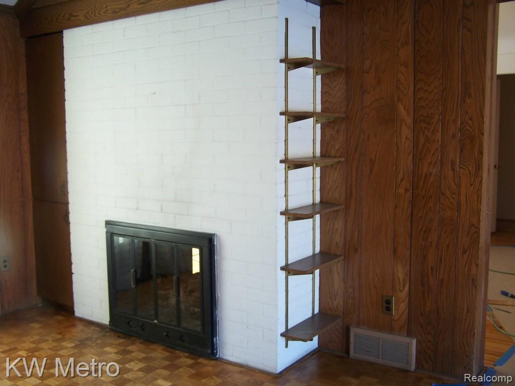 1716 Rosemont Road Berkley, MI 48072 - Photo 12 of 12 Cozy den with two sided fireplace into the living room