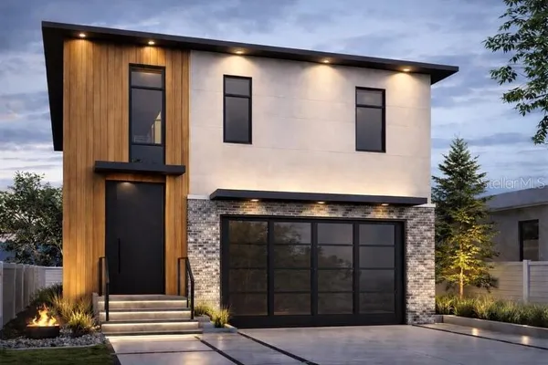 a front view of a house with a garage