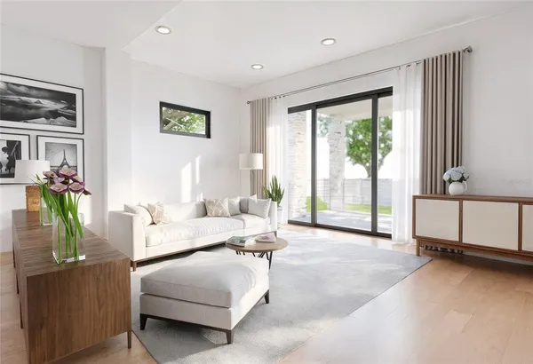 a large living room with stainless steel appliances kitchen island granite countertop a large kitchen counter top a stove and a sink