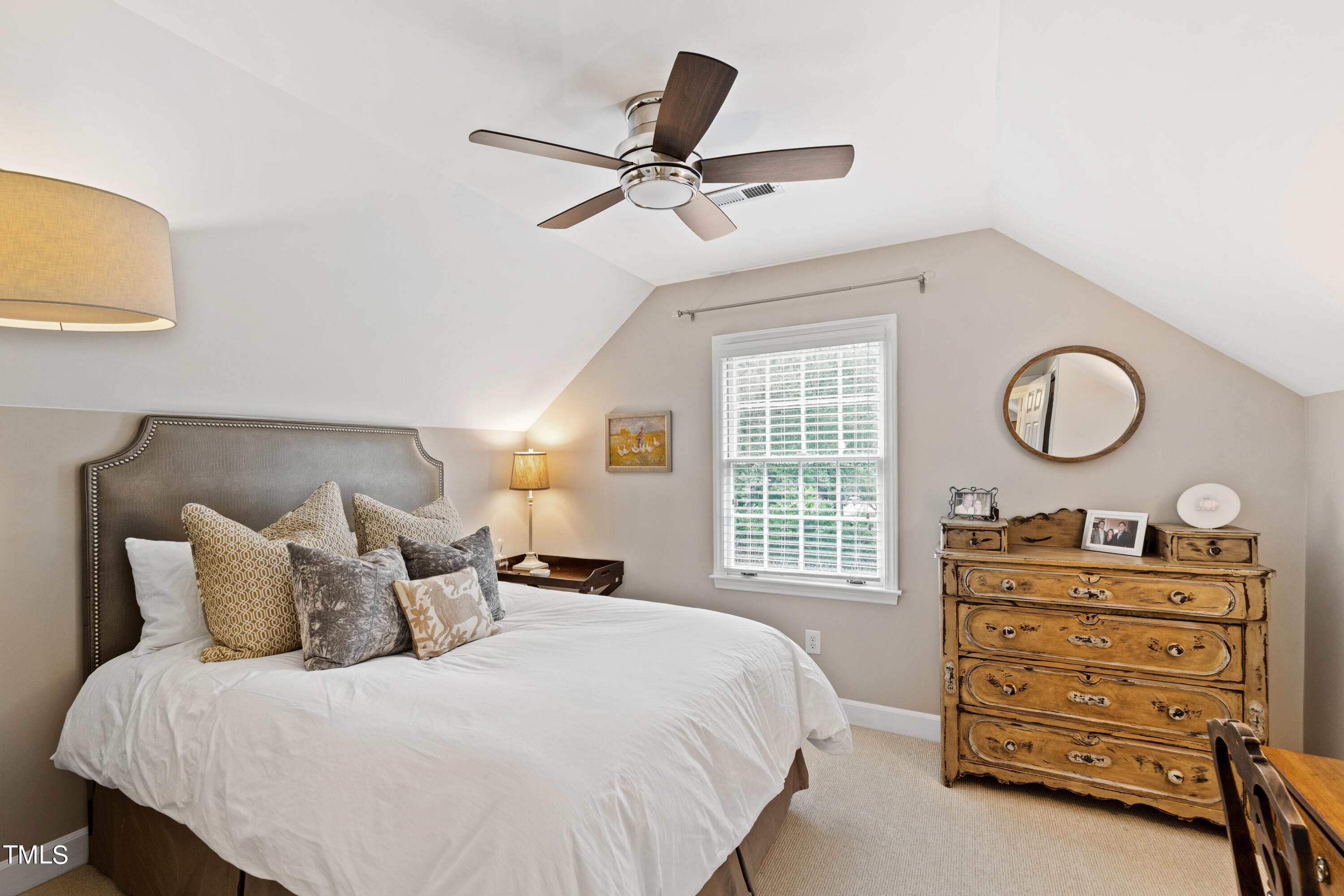 1816 Ridley Street Raleigh, NC 27608 - Photo 28 of 40 a bedroom with a bed and a dresser