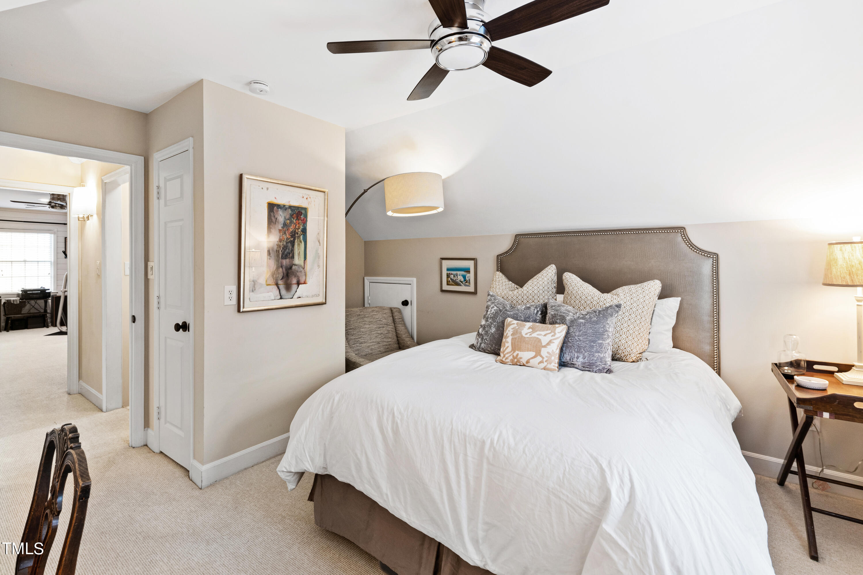 1816 Ridley Street Raleigh, NC 27608 - Photo 29 of 40 a bedroom with a bed and a chandelier