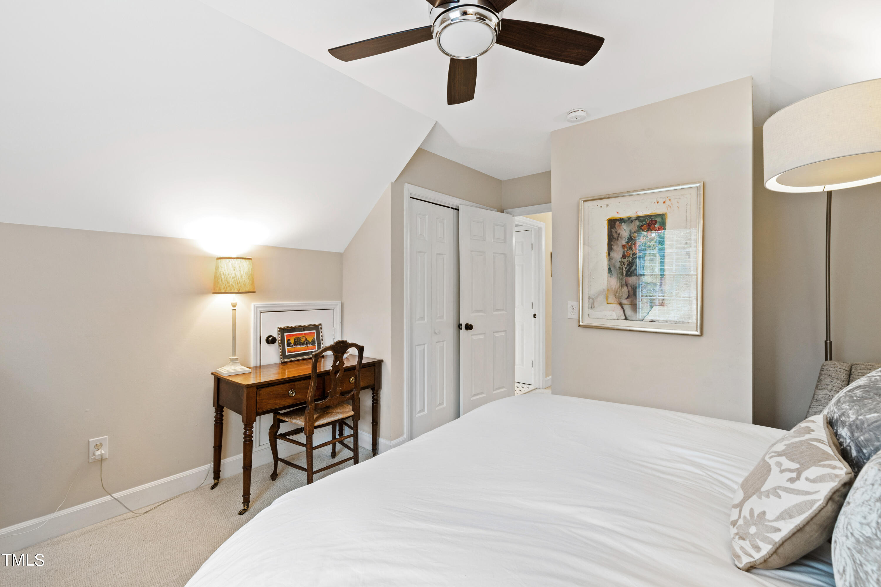 1816 Ridley Street Raleigh, NC 27608 - Photo 30 of 40 a bedroom with a bed and a desk