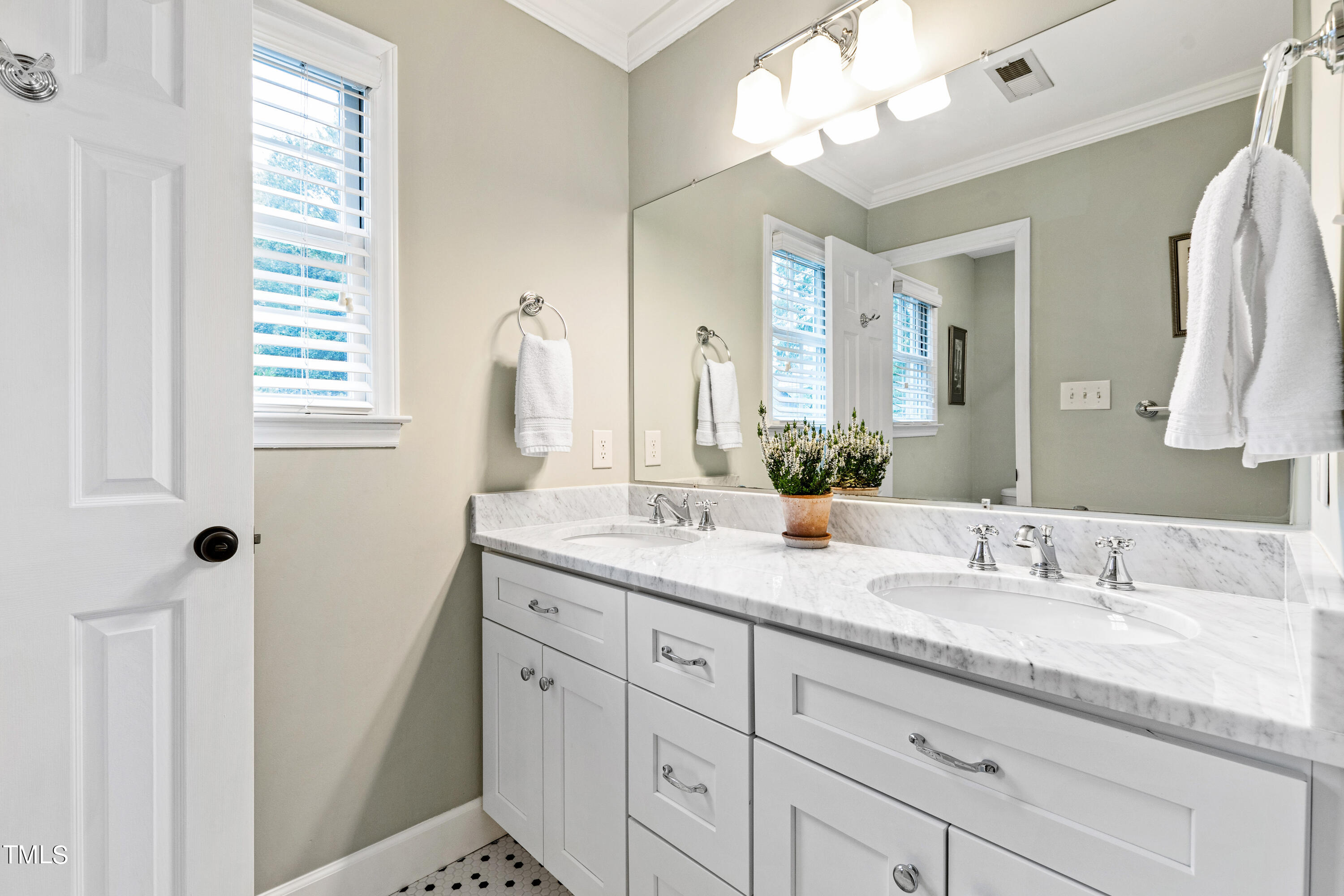 1816 Ridley Street Raleigh, NC 27608 - Photo 31 of 40 a bathroom with a granite countertop sink and a mirror