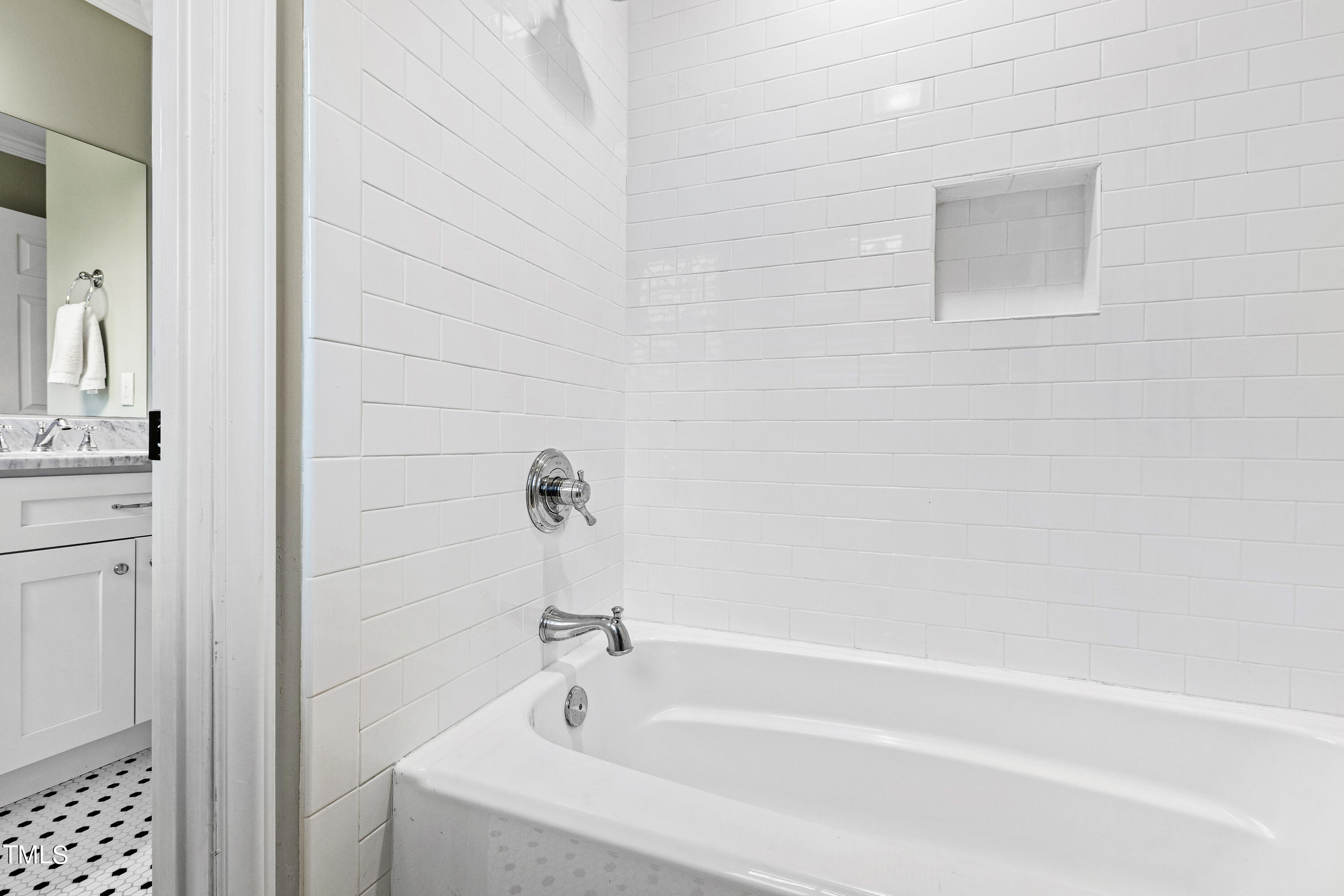 1816 Ridley Street Raleigh, NC 27608 - Photo 32 of 40 a white bath tub sitting next to a white sink