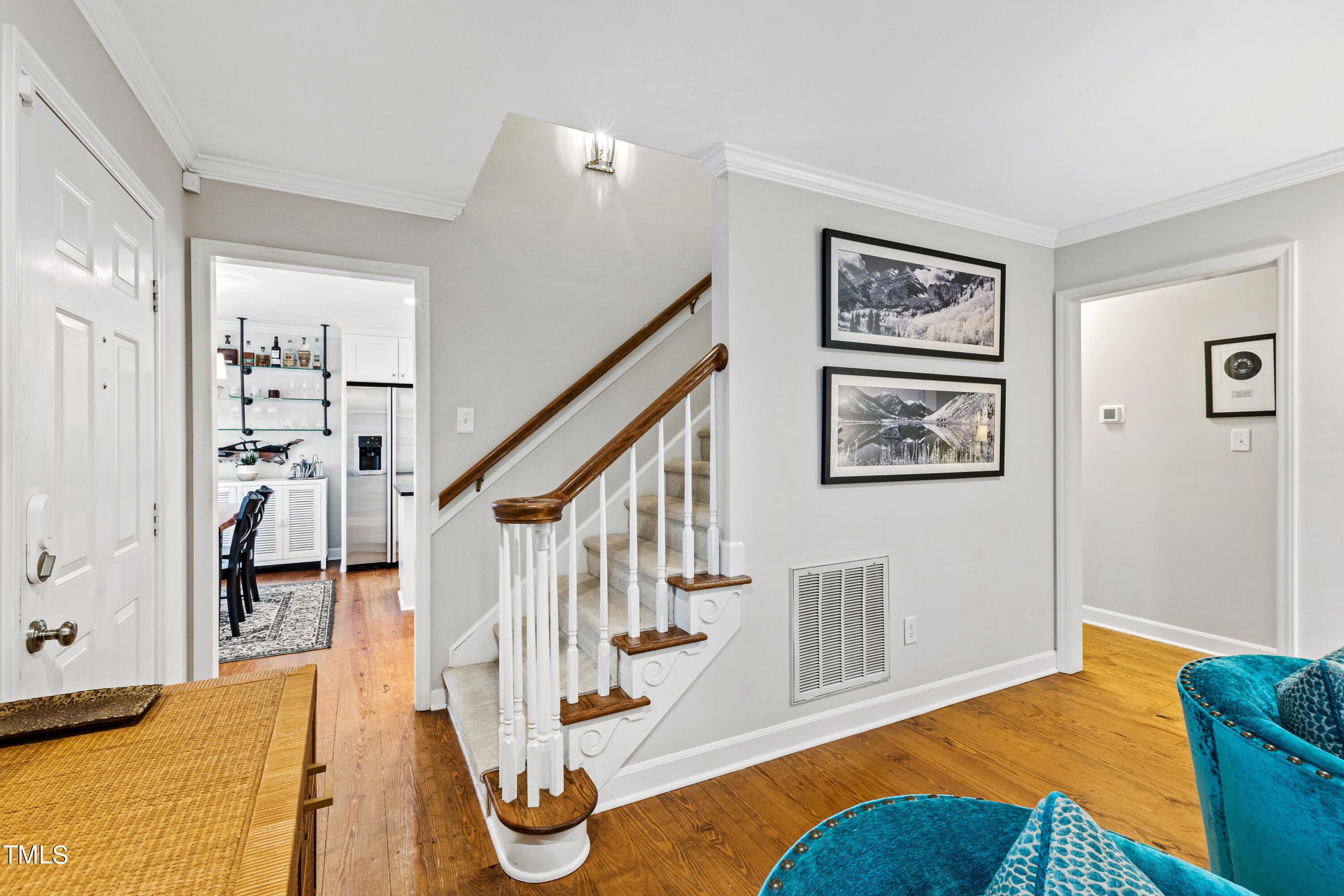 1816 Ridley Street Raleigh, NC 27608 - Photo 9 of 40 a view of an entryway with wooden floor and windows