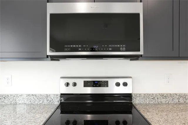 a bathroom with a stove and a microwave