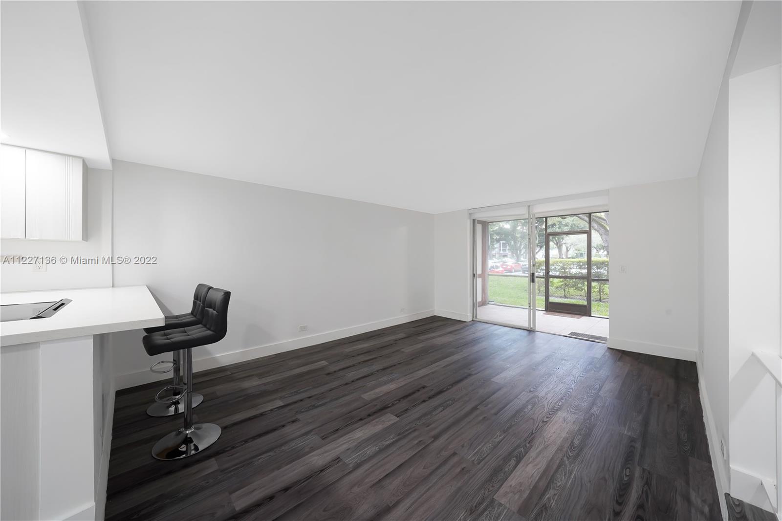 3670 Inverrary Drive, Unit 1I Lauderhill, FL 33319 - Photo 4 of 14 a view of a workspace with wooden floor