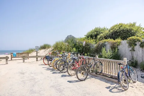 a view of a bench with iron fence