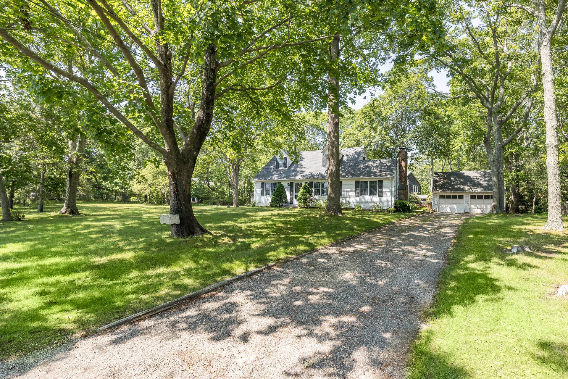 95 Sayre's Path Wainscott, NY 11975 - Photo 2 of 14 a view of a yard with plants and trees