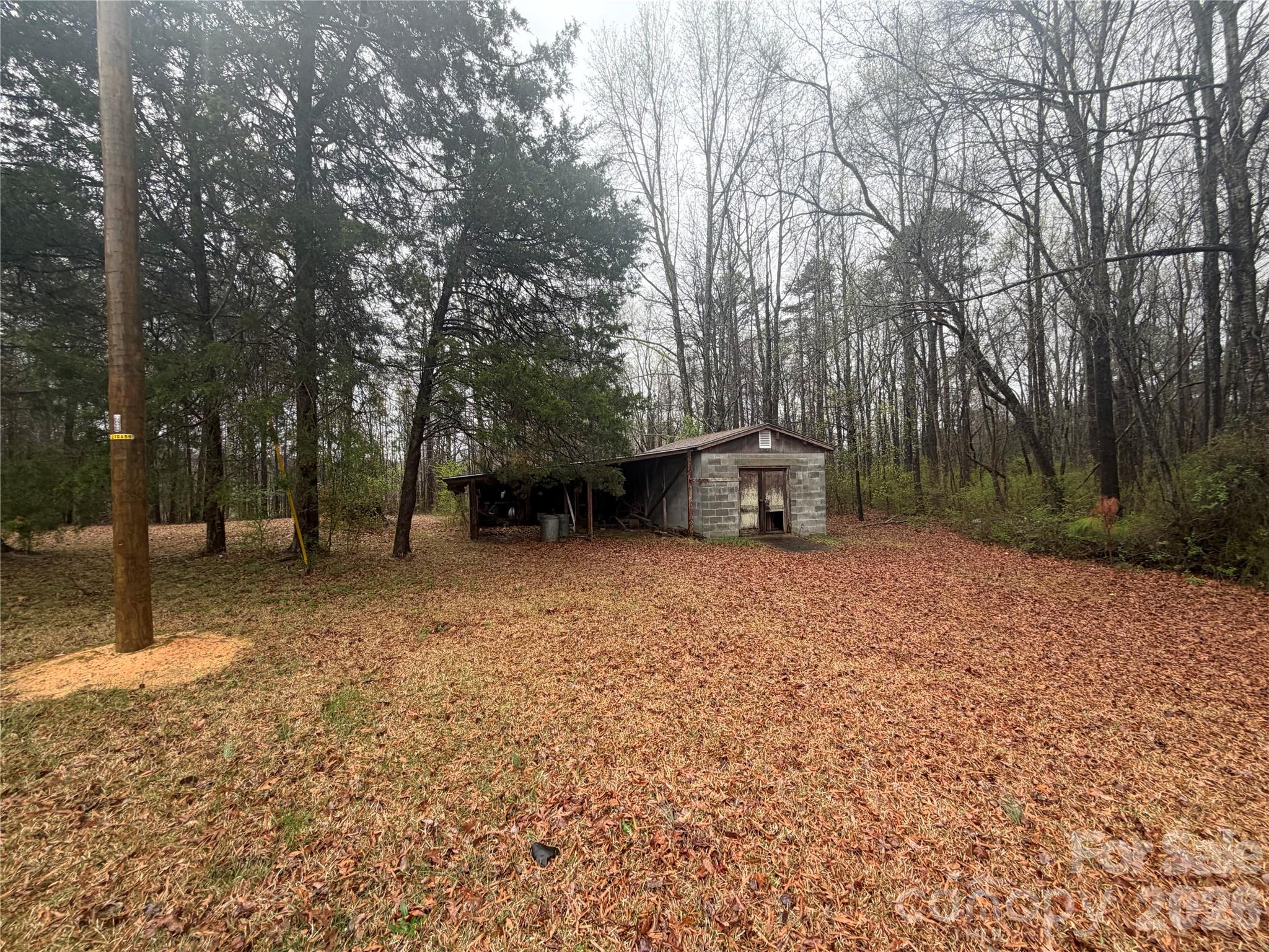 2990 Flat Creek Road Lancaster, SC 29720 - Photo 12 of 13 a backyard of a house with lots of green space