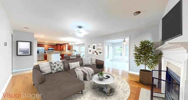 a living room with furniture and a dining table with wooden floor