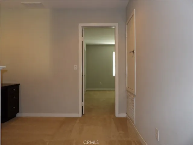 an empty room with mirror