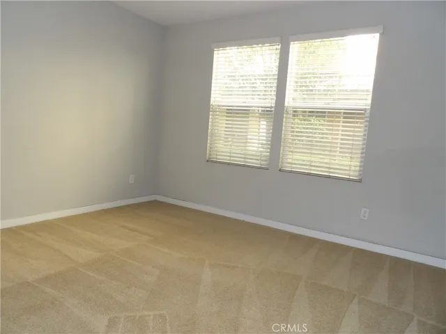 a bathroom with a sink vanity mirror and toilet