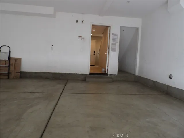 a front view of a house with a street