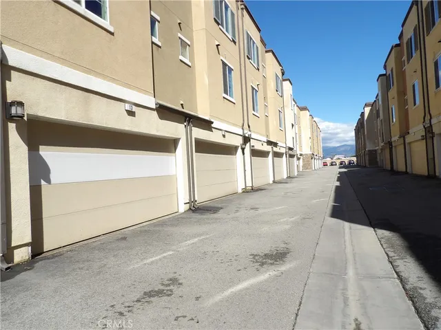 a view of a pathway with flower plants