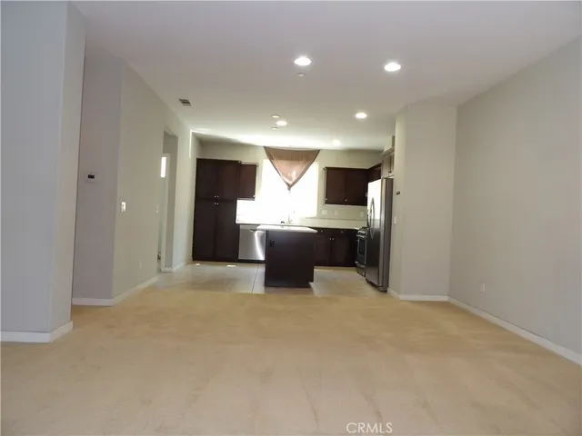 a view of a kitchen with a sink and cabinets