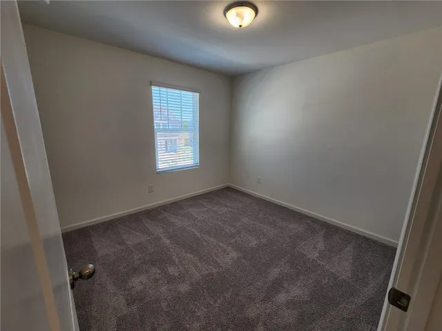 en empty room with windows