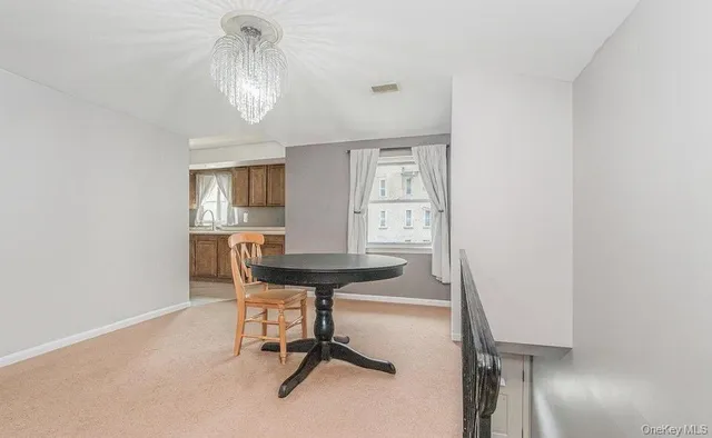 a view of a workspace with furniture