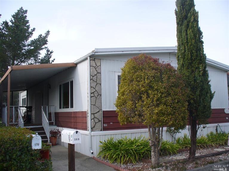 369 Yosemite Road, Unit 369 San Rafael, CA 94903 - Photo 1 of 1 a view of a house with a small yard and plants