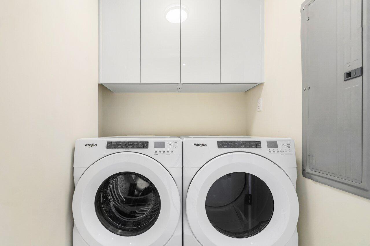 3100 North Ocean Drive, Unit 1505 Riviera Beach, FL 33404 - Photo 18 of 60 a view of entryway with washer and dryer