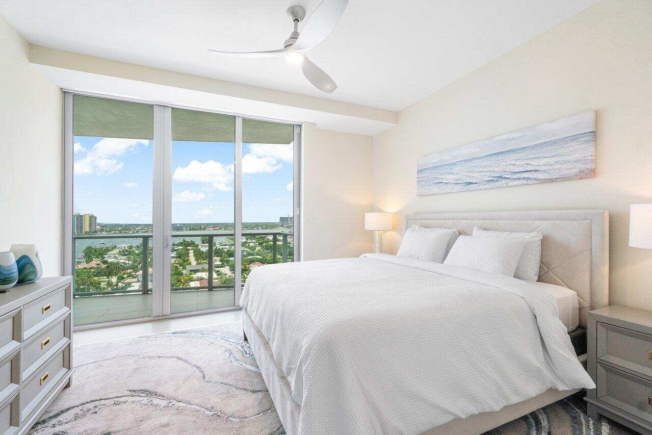 3100 North Ocean Drive, Unit 1505 Riviera Beach, FL 33404 - Photo 26 of 60 a bedroom with a large window and a bed