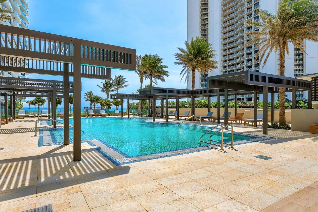 3100 North Ocean Drive, Unit 1505 Riviera Beach, FL 33404 - Photo 49 of 60 a view of a swimming pool with a patio